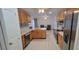 Spacious kitchen with light wood cabinets, stainless steel appliances, and an island at 1524 New Jersey Oaks Ct, Lakeland, FL 33801