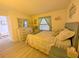 Bright, airy bedroom with beach-themed decor, comfortable bed, and charming coastal accents at 3100 Ocean Shore Blvd # 101, Ormond Beach, FL 32176