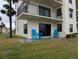 Exterior patio featuring outdoor seating and a sliding glass door for seamless indoor-outdoor living at 3100 Ocean Shore Blvd # 101, Ormond Beach, FL 32176