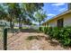 Fenced backyard with greenery and a patio at 4346 Thomas Wood Ln E, Winter Haven, FL 33880