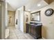 Elegant bathroom featuring a large vanity with granite counter top at 4346 Thomas Wood Ln E, Winter Haven, FL 33880