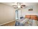 Comfortable bedroom with tile floors and a view into the bathroom at 4346 Thomas Wood Ln E, Winter Haven, FL 33880