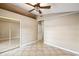 Spacious bedroom with neutral walls, tiled floor, and ceiling fan at 4346 Thomas Wood Ln E, Winter Haven, FL 33880