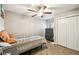 Cozy bedroom with tile floors, a ceiling fan and closet at 4346 Thomas Wood Ln E, Winter Haven, FL 33880