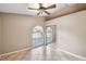 Bright bedroom featuring two large windows and tiled floors at 4346 Thomas Wood Ln E, Winter Haven, FL 33880