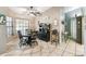 Dining room with tile floors, large window, and quaint decor at 4346 Thomas Wood Ln E, Winter Haven, FL 33880