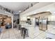 Kitchen with stainless steel appliances, granite counters, white cabinets, and a functional island at 4346 Thomas Wood Ln E, Winter Haven, FL 33880