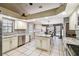 Spacious kitchen features white cabinetry, granite countertops, and stainless steel appliances at 4346 Thomas Wood Ln E, Winter Haven, FL 33880