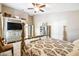 Main bedroom featuring neutral décor and a TV at 4346 Thomas Wood Ln E, Winter Haven, FL 33880