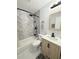 Nicely remodeled bathroom featuring tub and shower combo and new vanity at 635 Mccormick St, Daytona Beach, FL 32114