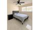 Bedroom with a ceiling fan, marble floors, dresser, window, and tufted headboard at 635 Mccormick St, Daytona Beach, FL 32114