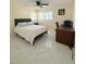 Bright bedroom featuring a ceiling fan, modern flooring, and a dedicated desk area at 635 Mccormick St, Daytona Beach, FL 32114