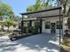 Charming home with covered parking, a modern walkway, and fresh landscaping with colorful flowers at 635 Mccormick St, Daytona Beach, FL 32114