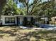 Charming home featuring covered parking, walkway, landscaping, and well-maintained lawn at 635 Mccormick St, Daytona Beach, FL 32114