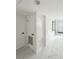 Hallway featuring modern flooring and neutral walls leading to the front door at 635 Mccormick St, Daytona Beach, FL 32114
