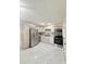 Bright kitchen with stainless steel appliances, light wood cabinets, and white marble floors at 635 Mccormick St, Daytona Beach, FL 32114