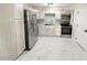Spacious kitchen featuring stainless steel appliances and freshly painted cabinets at 635 Mccormick St, Daytona Beach, FL 32114