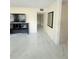 Clean living room with a marble floor and modern TV console at 635 Mccormick St, Daytona Beach, FL 32114
