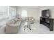 Inviting living room with large windows and modern flooring at 635 Mccormick St, Daytona Beach, FL 32114