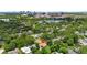Aerial view of a home near a lake in a neighborhood with nearby views of the downtown skyline at 1105 Chichester St, Orlando, FL 32803