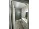 Modern bathroom features a glass-enclosed shower, stylish vanity, and updated fixtures at 1105 Chichester St, Orlando, FL 32803