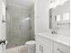 Modern bathroom featuring a glass shower and updated vanity with stylish fixtures at 1105 Chichester St, Orlando, FL 32803