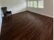 Bright and airy bedroom features ample windows and stylish wood-look flooring at 1105 Chichester St, Orlando, FL 32803