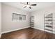 Minimalist bedroom featuring hardwood floors and shelves, creating a serene atmosphere at 1105 Chichester St, Orlando, FL 32803