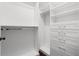Walk-in closet featuring custom shelving and drawers at 1105 Chichester St, Orlando, FL 32803