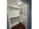 Walk-in closet with custom shelves, drawers, and ample storage space at 1105 Chichester St, Orlando, FL 32803