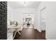 Open-concept dining area with built-in banquette seating and views to living room at 1105 Chichester St, Orlando, FL 32803