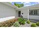 Close up of a charming front door and well-maintained landscaping. House number 1105 at 1105 Chichester St, Orlando, FL 32803