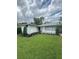 Charming single-story home with a well-manicured front lawn, lush landscaping, and inviting curb appeal at 1105 Chichester St, Orlando, FL 32803