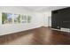 Bright living room featuring hardwood floors, and many windows allowing for lots of natural light at 1105 Chichester St, Orlando, FL 32803