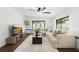 Bright living room with large windows and a neutral color palette at 1105 Chichester St, Orlando, FL 32803