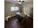 Well-lit home office featuring a large wooden desk, modern shelving, and comfortable seating perfect for working from home at 1105 Chichester St, Orlando, FL 32803