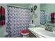 Bathroom featuring a vanity, a decorative mirror, and an eye-catching Paris-themed shower curtain at 56 Pine Trak # 101E, Ocala, FL 34472
