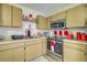Efficient kitchen featuring ample counter space and stainless steel appliances for a modern feel at 56 Pine Trak # 101E, Ocala, FL 34472