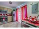Functional kitchen with stainless steel refrigerator and adjacent dining area with table setting at 56 Pine Trak # 101E, Ocala, FL 34472