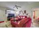 Cozy living room boasting tile flooring, ample seating, and a relaxing atmosphere at 56 Pine Trak # 101E, Ocala, FL 34472