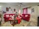 Comfortable living room with vaulted ceiling, plush seating, and stylish decor at 56 Pine Trak # 101E, Ocala, FL 34472