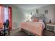Serene main bedroom with cozy decor and ample natural light at 56 Pine Trak # 101E, Ocala, FL 34472