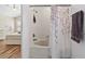 Bathroom with tub and shower featuring decorative shower curtain at 6059 Twain St # 108, Orlando, FL 32835