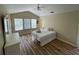 Bedroom with a bright window and a ceiling fan, with a bed and dresser at 6059 Twain St # 108, Orlando, FL 32835