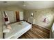 Bedroom with a bright window and a ceiling fan, with a bed and dresser at 6059 Twain St # 108, Orlando, FL 32835