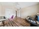 Spacious bedroom featuring modern floors, ceiling fan, and ample natural light at 6059 Twain St # 108, Orlando, FL 32835
