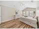 Bedroom with bed, dresser, vaulted ceiling, and natural light at 6059 Twain St # 108, Orlando, FL 32835