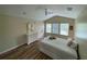 Bedroom with a bright window and a ceiling fan, with a bed and dresser at 6059 Twain St # 108, Orlando, FL 32835