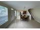 The foyer features neutral tones, tile flooring, and a staircase leading to the second floor at 6059 Twain St # 108, Orlando, FL 32835