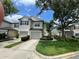 Attractive townhome with well-kept landscaping, a private driveway, and a cozy neighborhood feel at 6059 Twain St # 108, Orlando, FL 32835